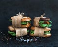 Cured chicken and spinach whole grain sandwiches placed one on a Royalty Free Stock Photo