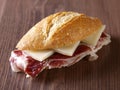 Cured ham and cheese sandwich. Royalty Free Stock Photo