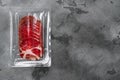 Cured meat coppa pack, on gray stone table background, top view flat lay, with copy space for text Royalty Free Stock Photo