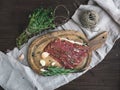 Cured pork meat or prosciutto on a rustic woodem board with garli Royalty Free Stock Photo