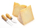 Cured sheep cheese Manchego type in wedge and cutlery. Isolate