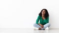 Curious african american woman looking at copy space on white Royalty Free Stock Photo