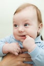 Curious baby boy with finger in his mouth Royalty Free Stock Photo