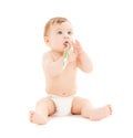 Curious baby brushing teeth Royalty Free Stock Photo