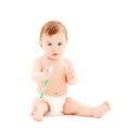 Curious baby brushing teeth Royalty Free Stock Photo