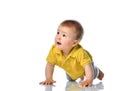 Curious baby crawling on white floor studio shot Royalty Free Stock Photo