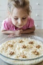 Curious Blonde Little Girl Observing Large Dish Filled With Gullac, A Turkish Traditional Dessert