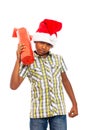 Curious boy with Christmas gift Royalty Free Stock Photo