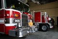 Curious Boy Sitting On A Fire Truck Royalty Free Stock Photo