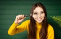 Curious brunette woman looking through the magnifying glass Royalty Free Stock Photo