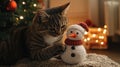 Curious Cat Exploring Handmade Snowman Decoration by Christmas Tree Royalty Free Stock Photo
