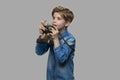 Curious caucasian boy using binoculars.