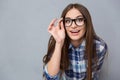 Curious cheerful woman in glasses looking at camera Royalty Free Stock Photo