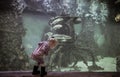 Curious child exploring underwater world with sunk bathyscaphe ship among floating fish in futuristic and fantastic big marine aqu