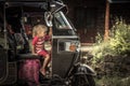 Curious child traveler girl on tuk tuk motor vehicle during traveling Asia concept happy carefree childhood travel lifestyle