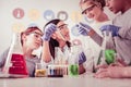 Curious children in protective glasses following their teacher