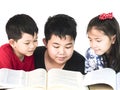 Curious children reading book