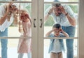 Curious couple with little kids standing and peering into their new home. Excited smiling caucasian family looking at Royalty Free Stock Photo