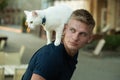 Curious explorer. Happy man on walk with cat pet. Muscular man hold cute pedigree cat. Happy cat owner with muscular Royalty Free Stock Photo