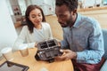 Curious friends scrutinizing interior part of VR headset