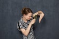 Curious girl is looking at her palm through magnifier