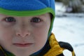 Young boy enjoying the snow on a cold winter day Royalty Free Stock Photo