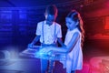 Curious kids feeling interested while holding a transparent tablet