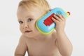 Curious Little Boy Using Toy Phone Royalty Free Stock Photo