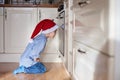 Curious little boy, watching ginger bread cookies in the oven Royalty Free Stock Photo