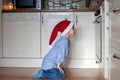 Curious little boy, watching ginger bread cookies in the oven Royalty Free Stock Photo