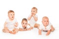 Curious looking group of babies on the white Royalty Free Stock Photo