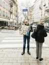 Curious male tourist reading a traveler tourist sightseeing map of Strasbourg in