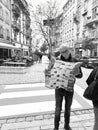 Curious male tourist reading a traveler tourist sightseeing map of Strasbourg in