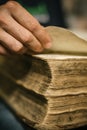 Curious man reading old book in his library at home Royalty Free Stock Photo