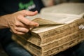 Curious man reading old book in his library at home Royalty Free Stock Photo