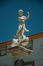 Curious marble statue on top of pillar