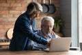 Curious mature man enjoying learning modern tech gadget usage.