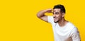 Curious middle-eastern guy smiling and looking at copy space Royalty Free Stock Photo