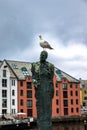 A Curious Seagull on The Head of A Man Statue Royalty Free Stock Photo