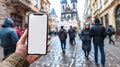 a curious tourist stands clutching a smartphone with a blank, white screen in a foreign city