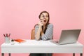 Curious woman in casual clothes looking through magnifying glass sit work at white desk with contemporary pc laptop Royalty Free Stock Photo