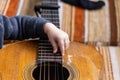 Curious young boy examines guitar