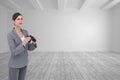 Curious young businesswoman with binoculars Royalty Free Stock Photo