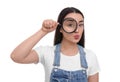 Curious young woman looking through magnifier glass on white background