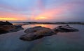 Curl Curl Rock Pool relfections of sunrise Royalty Free Stock Photo