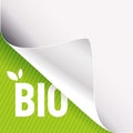 Curled white paper corner on green and Bio sign