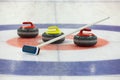 Curling rocks on ice Royalty Free Stock Photo
