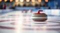 Curling stone in close-up, sliding on icy sheet. Royalty Free Stock Photo