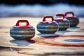 curling stones on ice Royalty Free Stock Photo