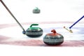 Curling stones on the ice